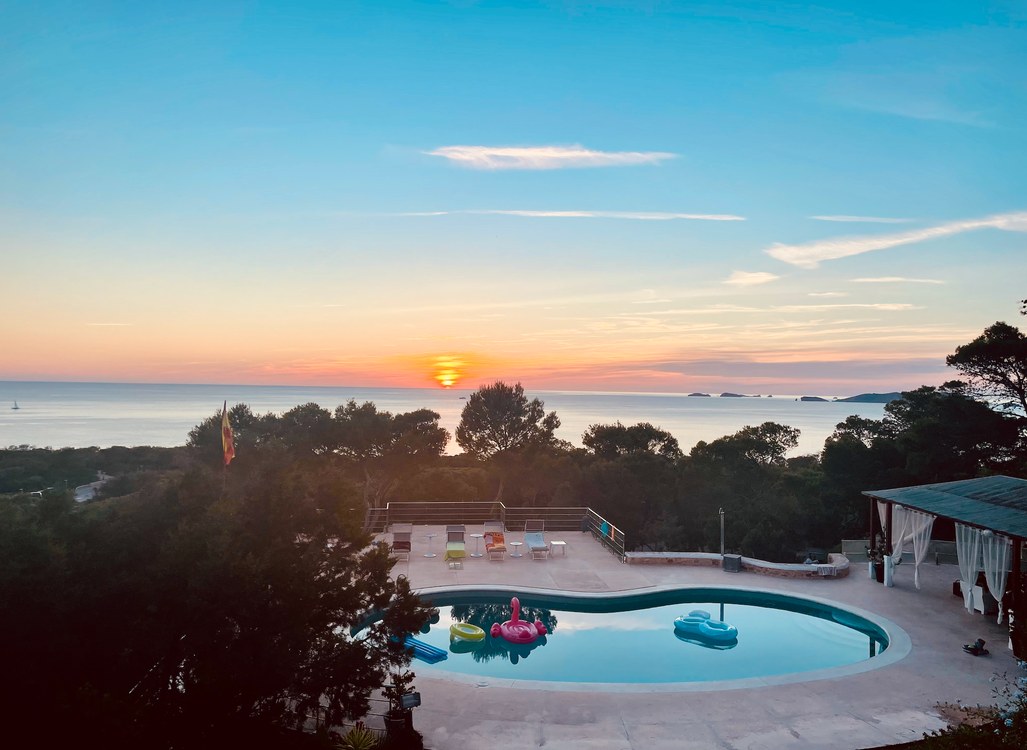 Villa Sa Mirada — swimming pool at sunset with panoramic Mediterranean sea view over Cala Vadella, Ibiza